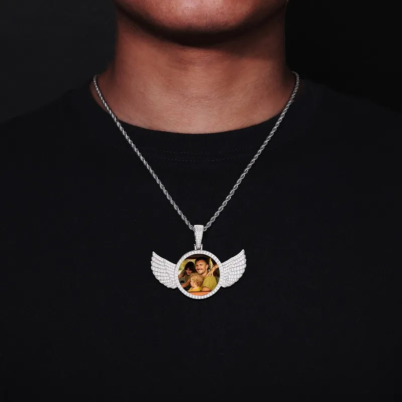 Model wearing 14k gold custom photo round wing pendant – 67mm iced-out personalized necklace