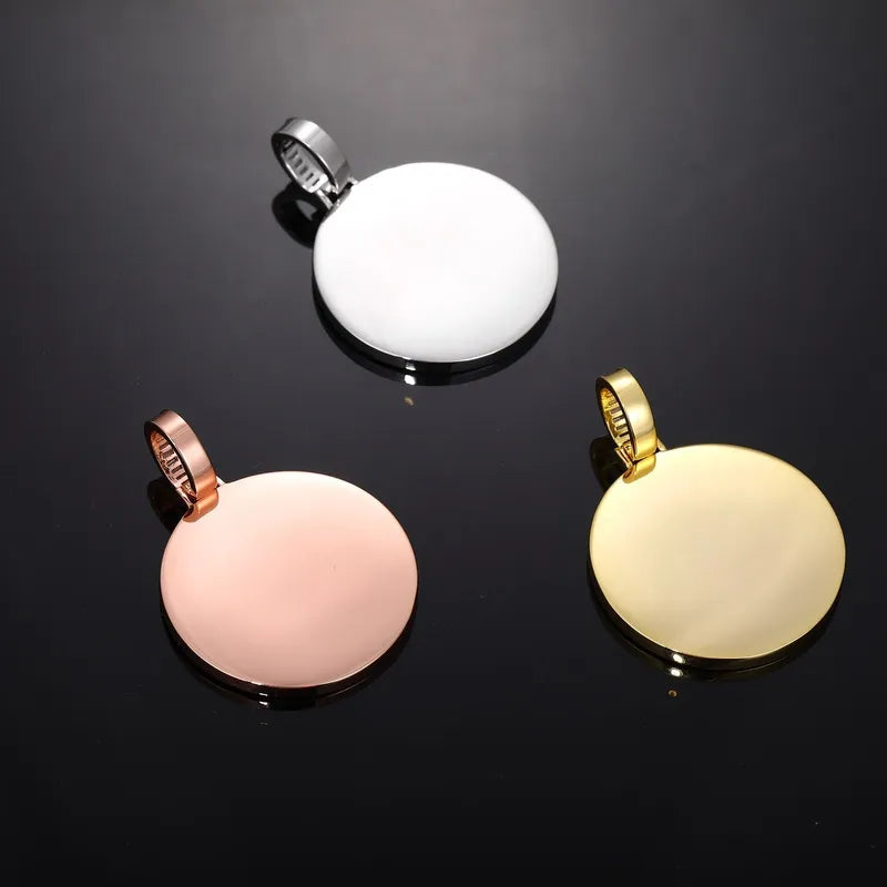 Three round custom pendant backs in silver, gold, and rose gold