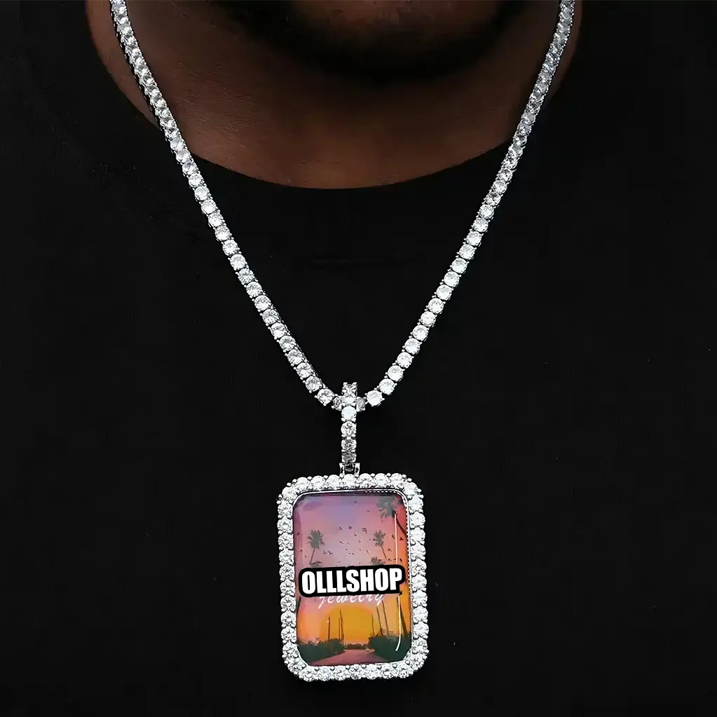 Silver custom photo pendant worn on a chain with diamond border