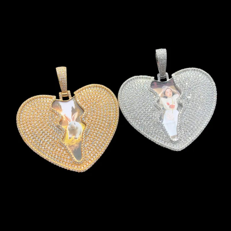 Two customized cracked heart pendants in silver and gold with diamonds