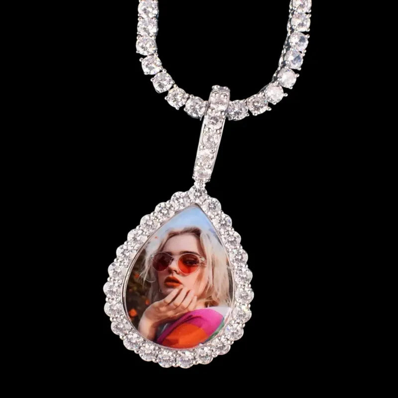 Close-up of 3D custom teardrop pendant with personalized photo and iced diamond border
