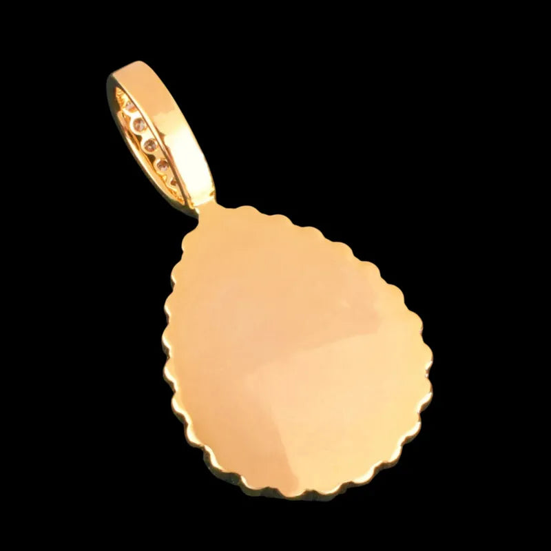 Reverse side of gold teardrop pendant showing plain back design