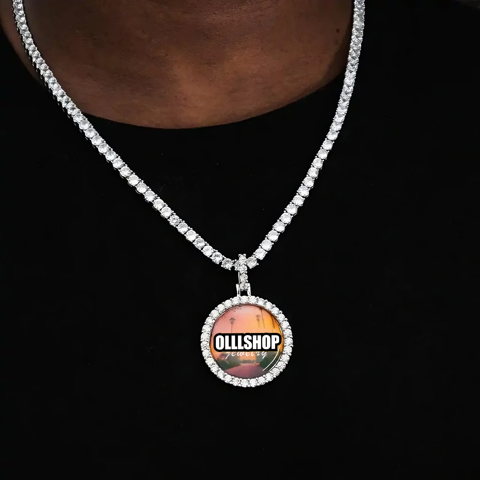 Personalized round photo pendant necklace with iced border on black shirt