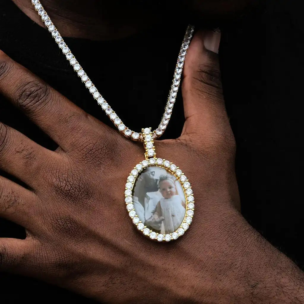 Oval custom photo pendant worn on chain with diamond frame
