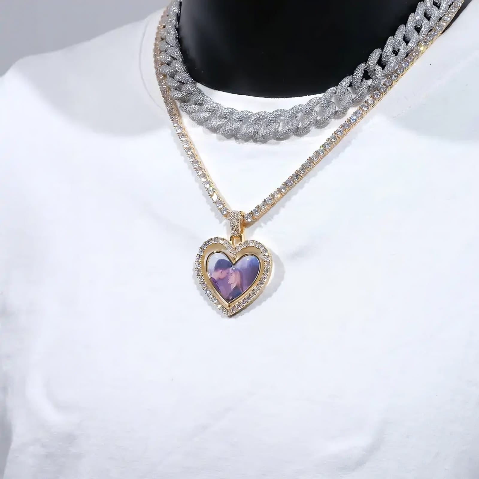 Double-sided custom heart pendant with two pictures, displayed on white shirt