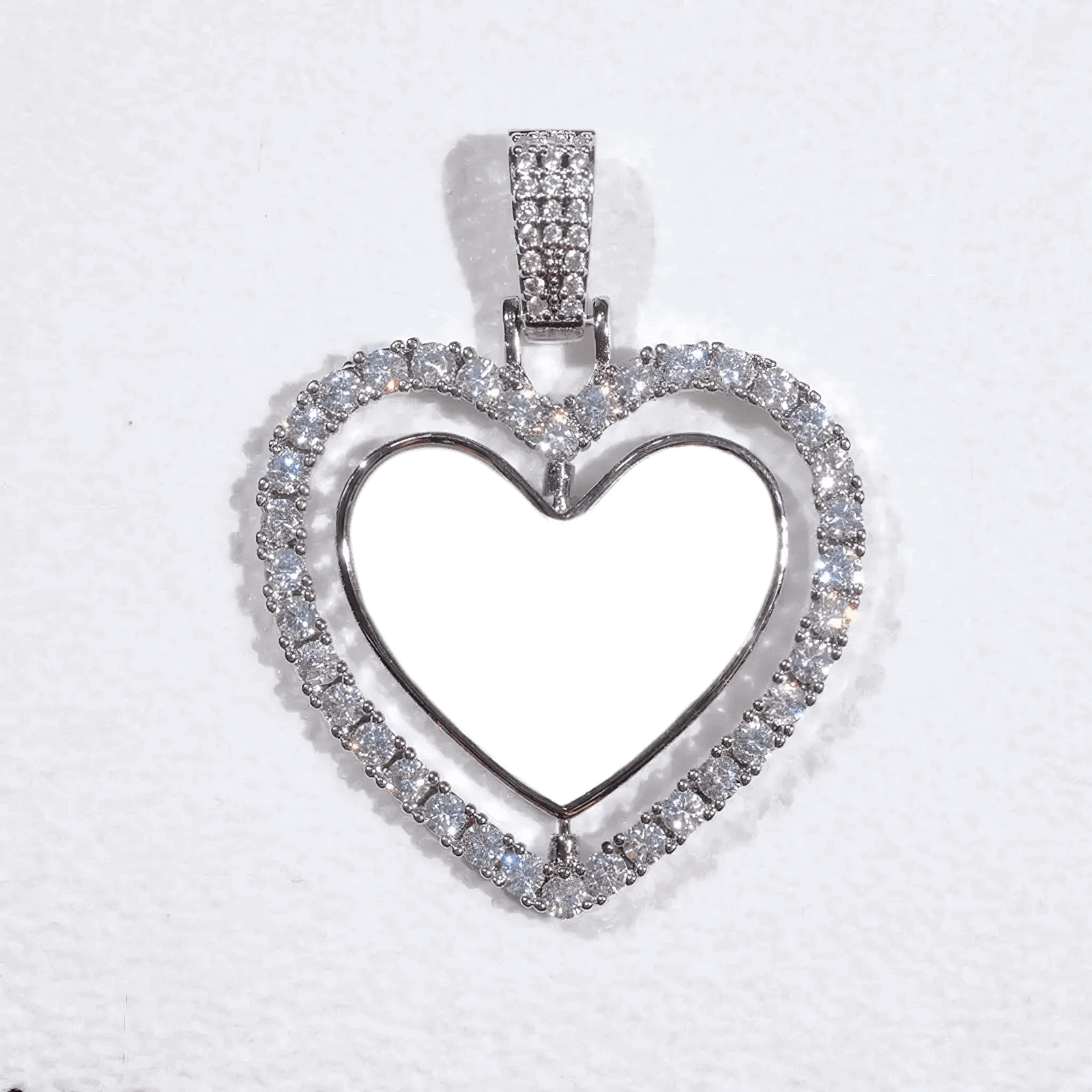 Heart-shaped frame pendant with micro-set diamonds and rotatable photo insert