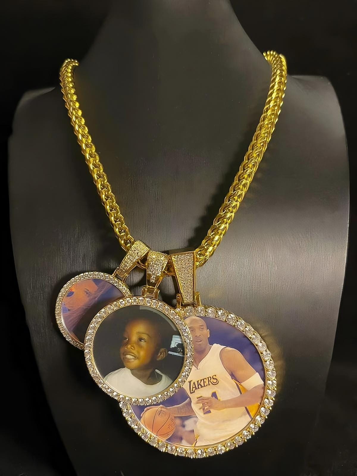 Set of multiple custom circle photo pendants displayed on mannequin