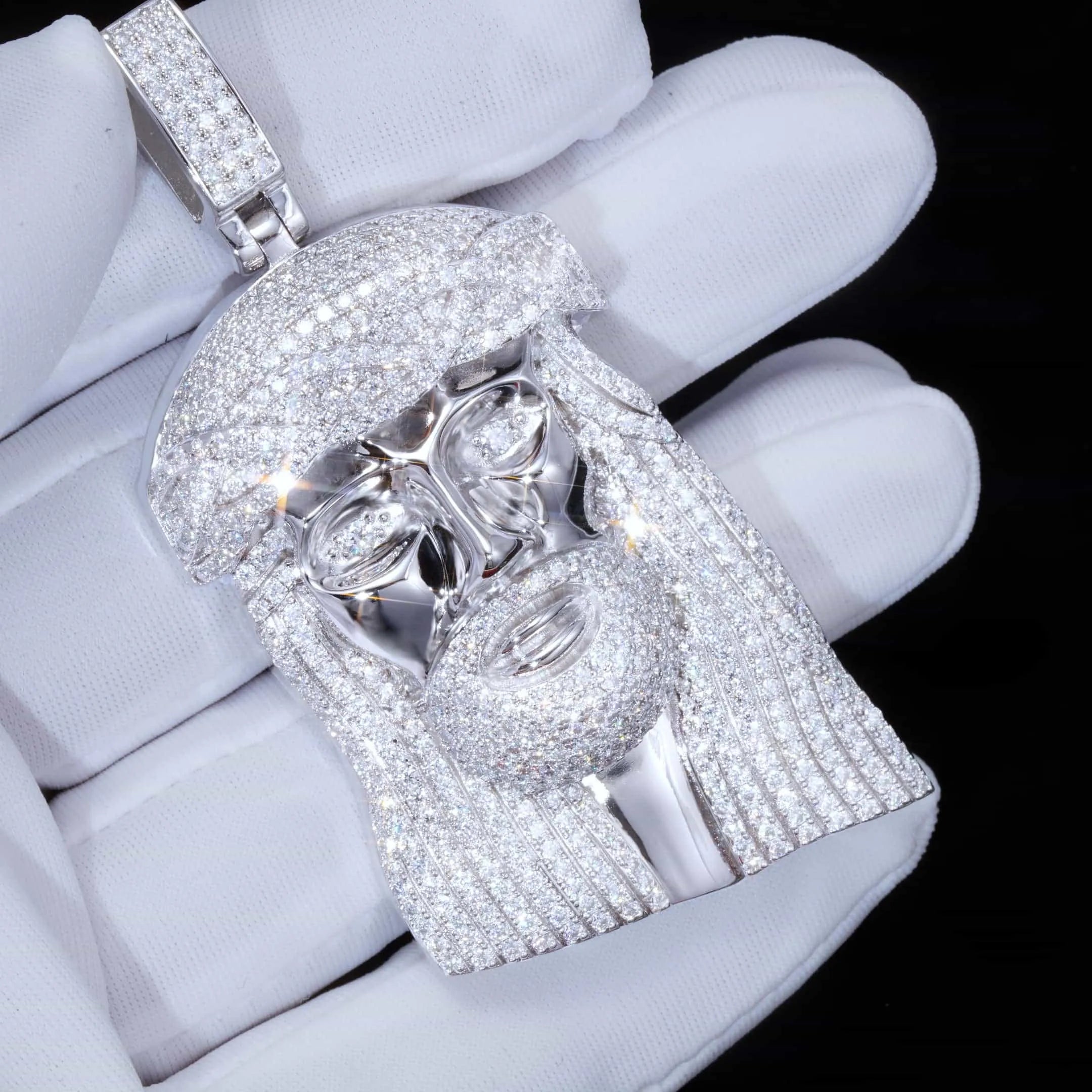 Close up iced out Jesus face pendant in white gold with moissanite diamonds
