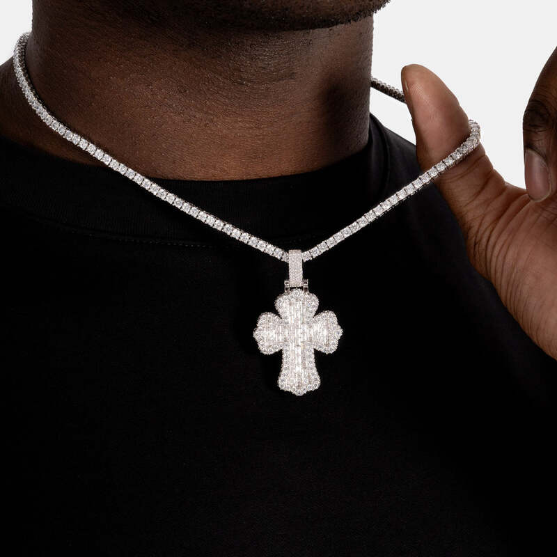 Man wearing iced baguette cross pendant in white gold close-up