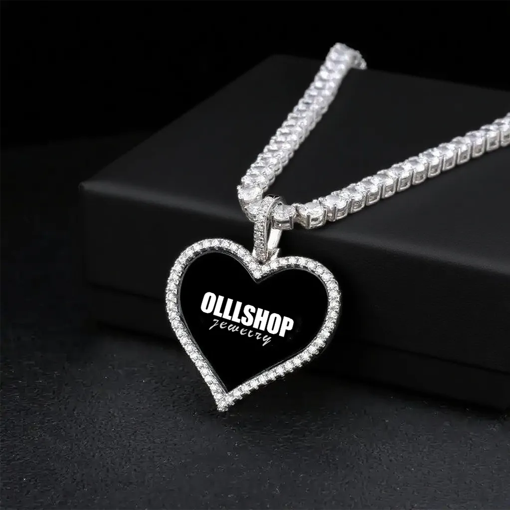 Silver heart photo pendant displayed on jewelry box