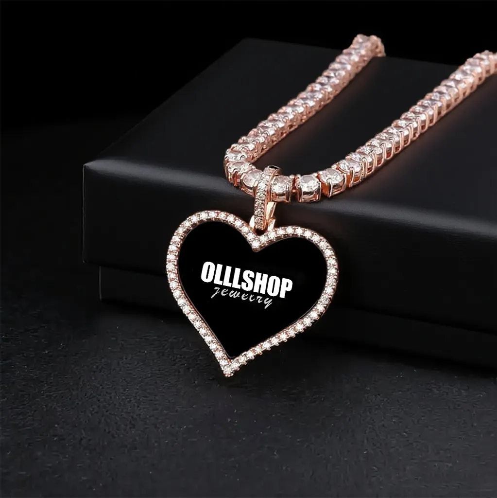Gold heart photo pendant displayed on jewelry box