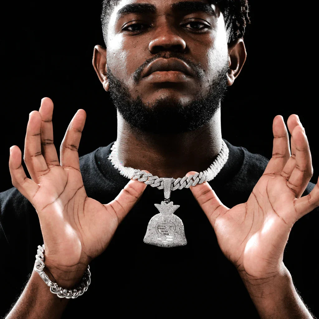 Man wearing iced money bag pendant with chain