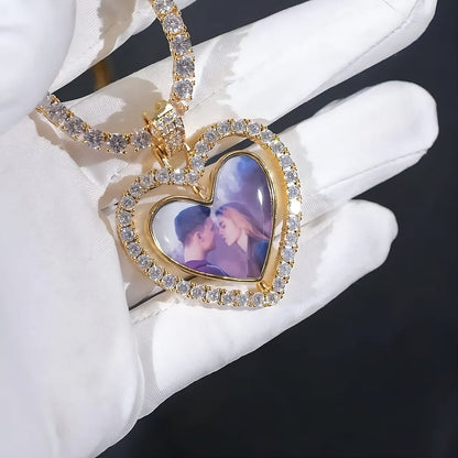 3D heart photo pendant with rotating design held in gloved hand 