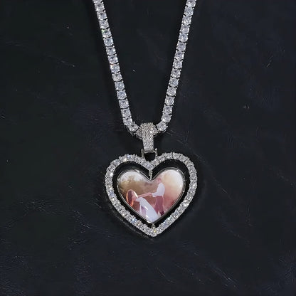 Close-up of custom two-sided spinning heart picture pendant in white gold