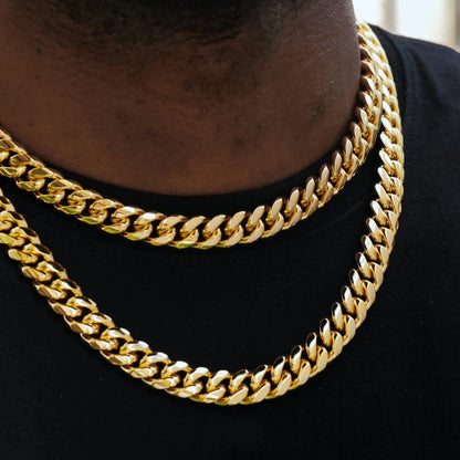 The 12mm Miami Cuban Link Choker by TONGSHOP has strong, sleek links and can be worn alone or layered. Available in 18" and 20" lengths and weighing up to 205 grams in 14k solid gold or 130 grams in 18k gold plated.