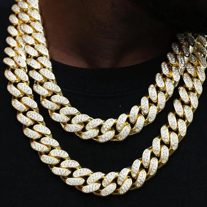 The 19mm Iced Cuban Link Choker is a bold twist on our classic chain. Made with flawless VVS simulated diamonds and 18K gold plating, it comes with a chain, dust bag, gift box, jewelry cloth, and warranty card. Available in lengths of 18, 20, and 24 inches.