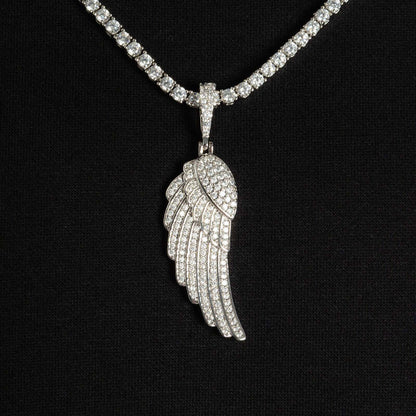 Close-up of diamond iced wing pendant in white gold