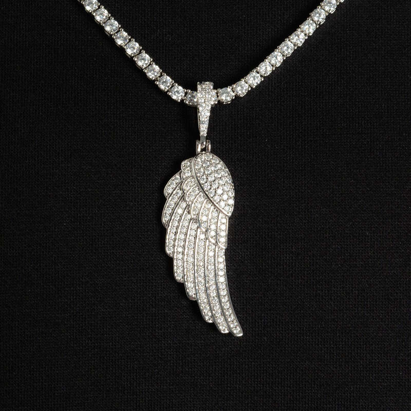 Close-up of diamond iced wing pendant in white gold