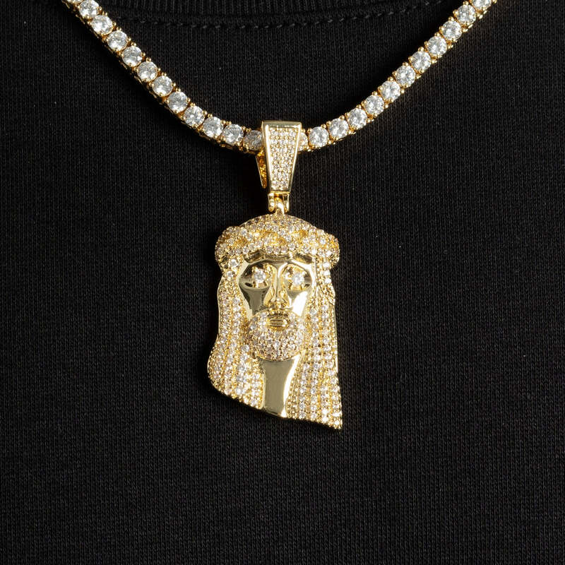 Detailed view of iced mini Jesus pendant necklace in white golD